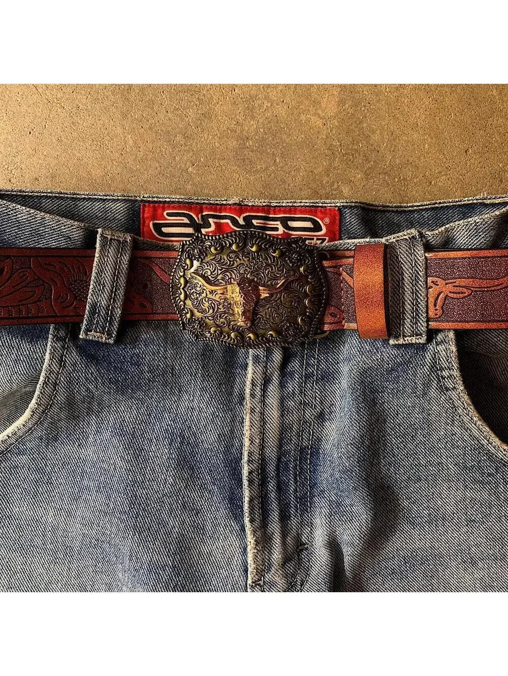 American Western Brown leather belt with silver-toned brass buckle, featuring a